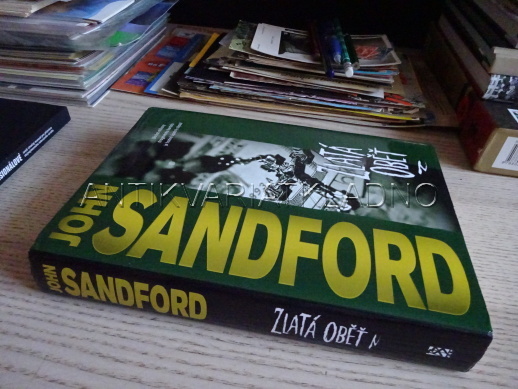 ZLATÁ OBĚŤ, JOHN SANDFORD, **an