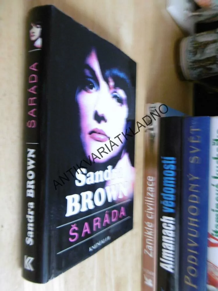 ŠARÁDA, SANDRA BROWN, **an