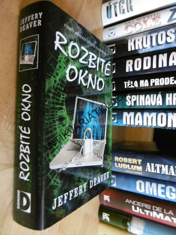 ROZBITÉ OKNO, JEFFERY DEAVER, **an