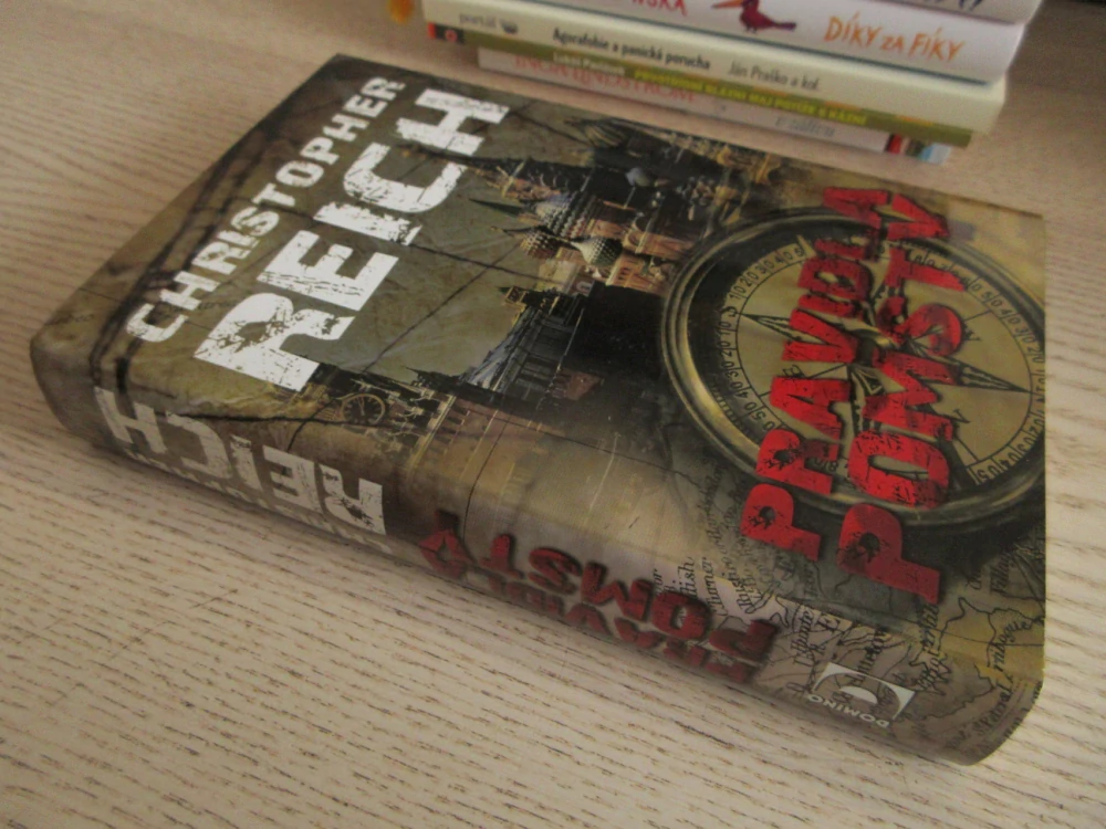 PRAVIDLA POMSTY, CHRISTOPHER REICH, **an