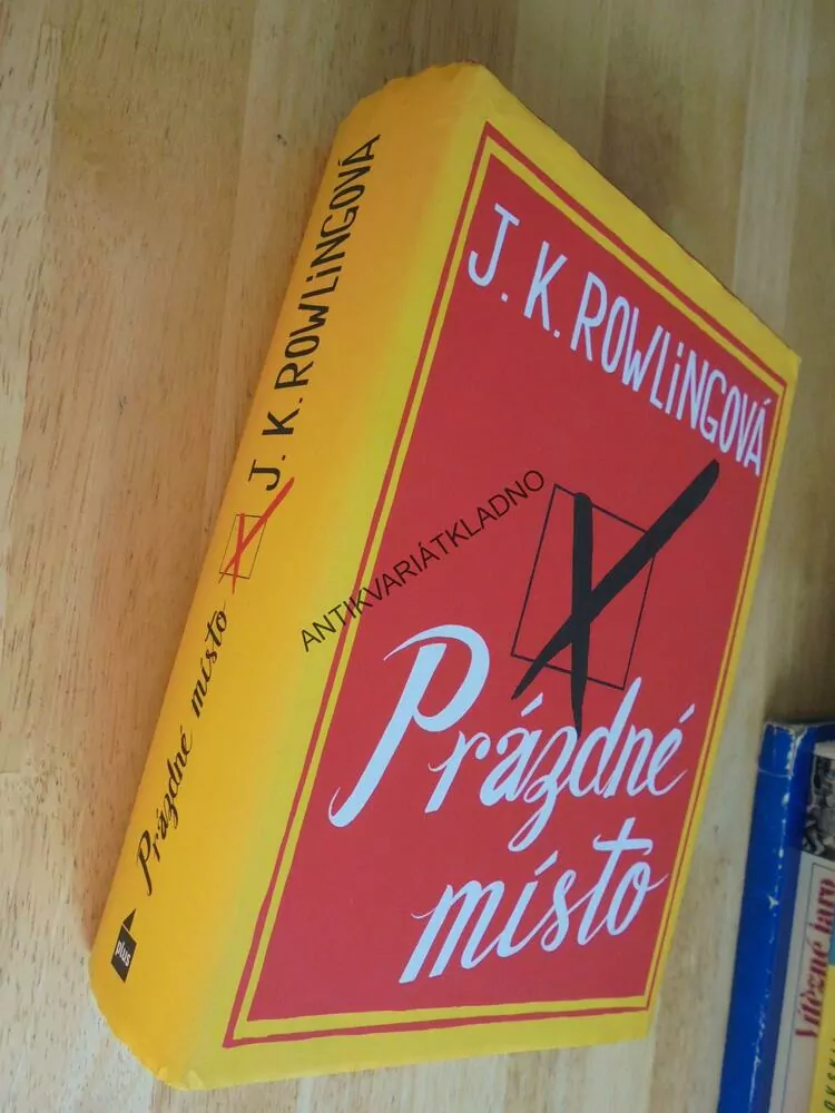 PRÁZDNÉ MÍSTO, J.K. ROWLINGOVÁ, **an