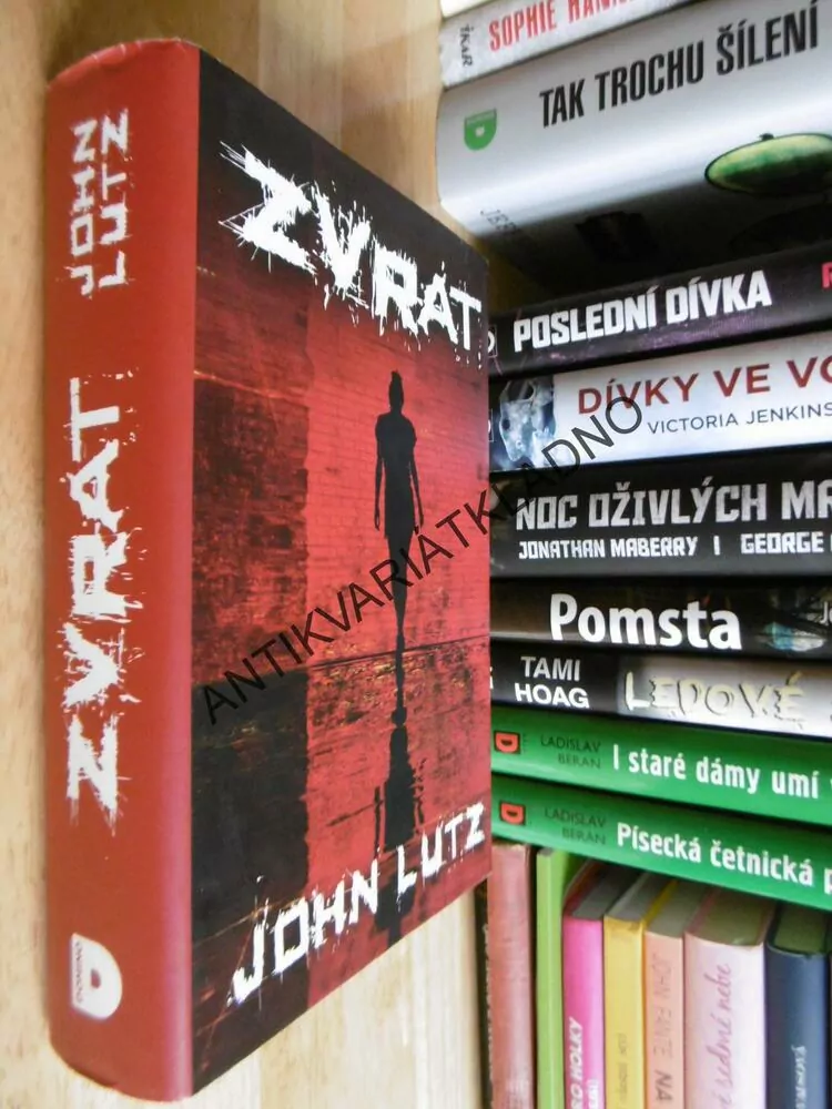 ZVRAT, JOHN LUTZ, **an