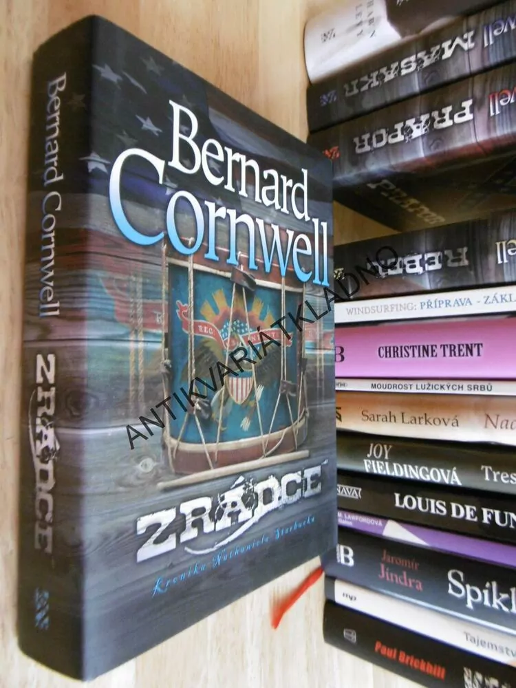 ZRÁDCE, BERNARD CORNWELL, **an