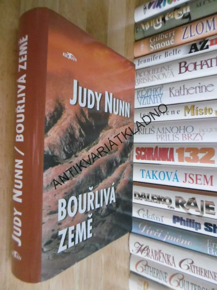 BOUŘLIVÁ ZEMĚ, JUDY NUNN, **an
