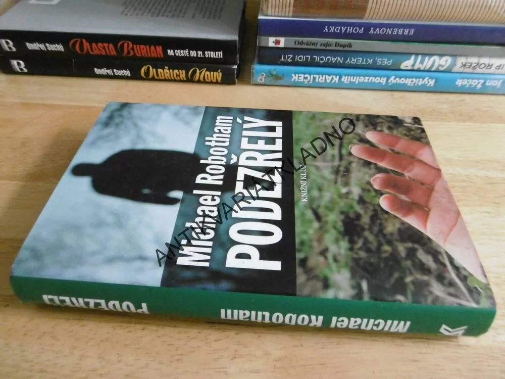 PODEZŘELÝ, MICHAEL ROBOTHAM, **an