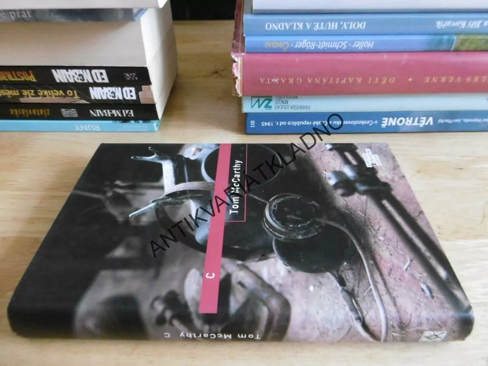 C, TOM MCCARTHY, **an