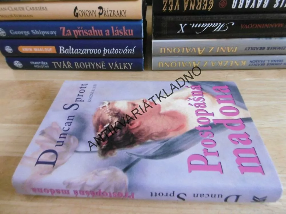PROSTOPÁŠNÁ MADONA, DUNCAN SPROTT, **an