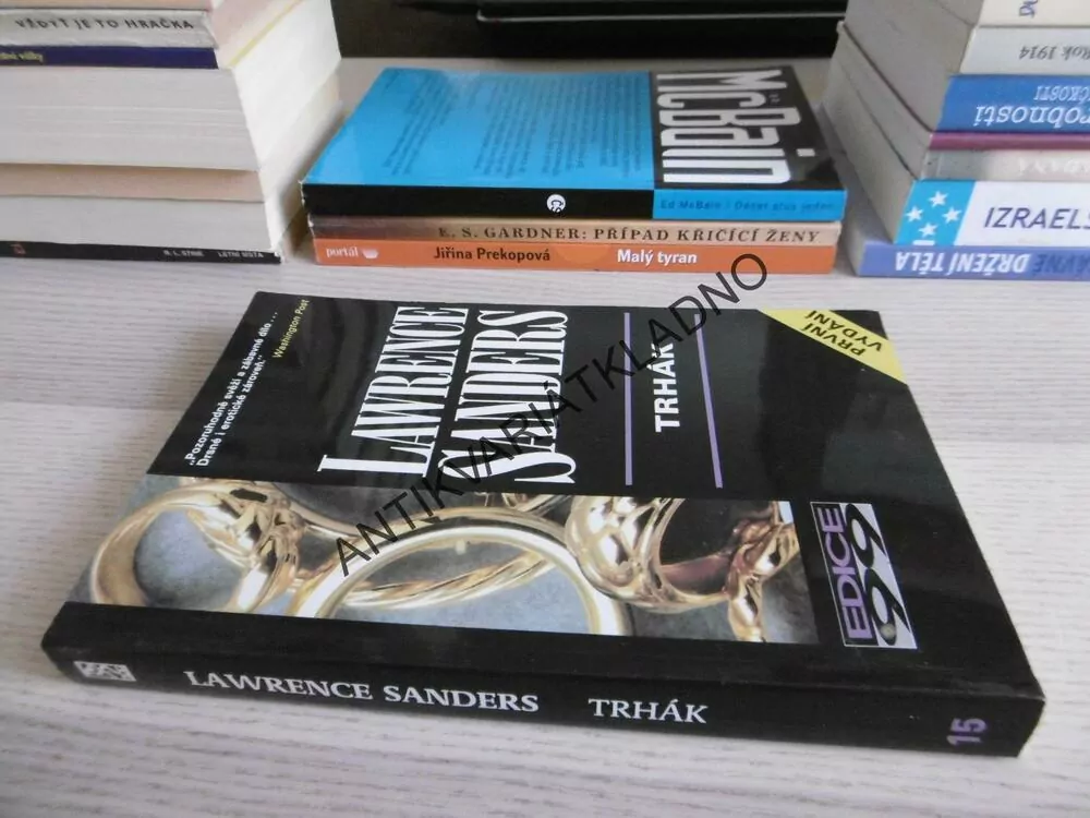 TRHÁK, LAWRENCE SANDERS, **an