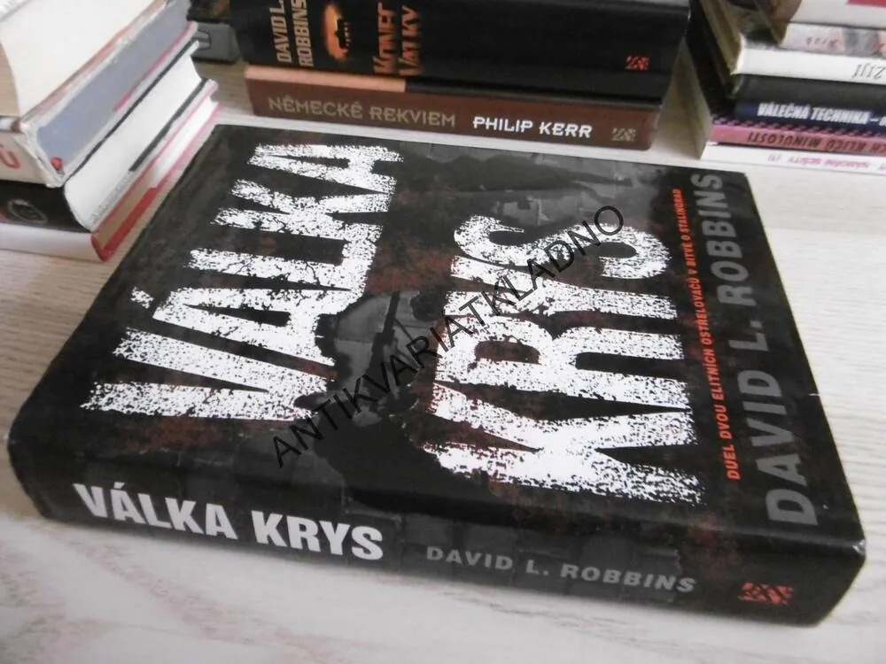 VÁLKA KRYS, DAVID L. ROBBINS, **an