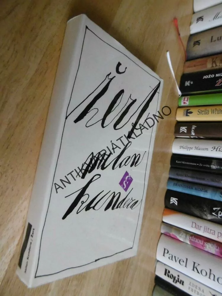 ŽERT, MILAN KUNDERA, **an