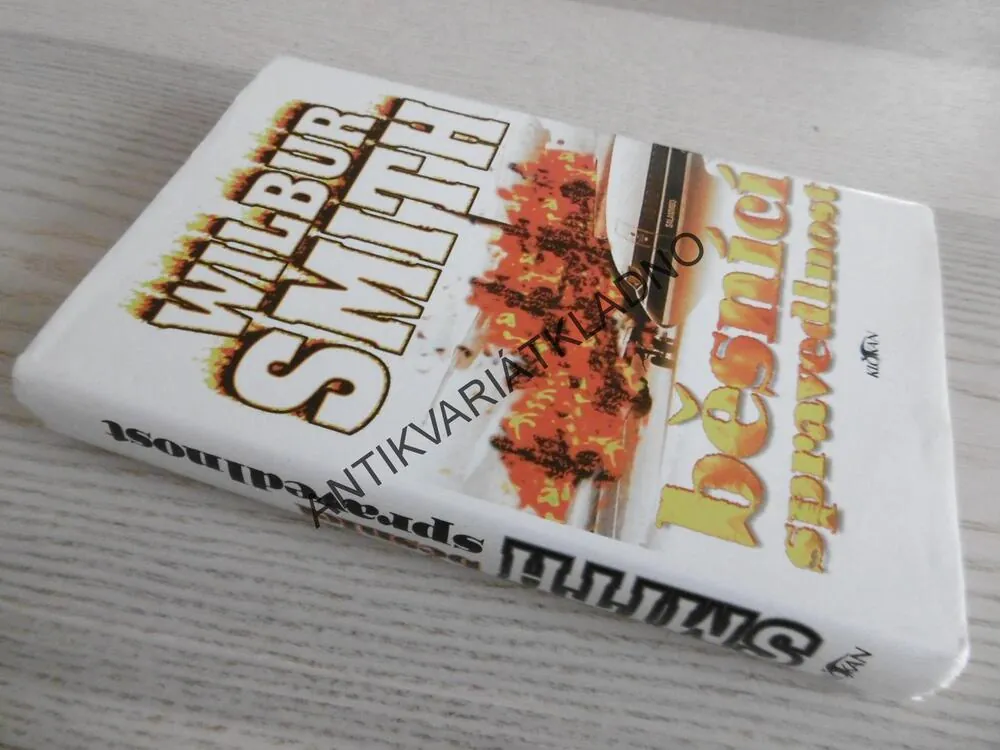 BĚSNÍCI SPRAVEDLNOST, WILBUR SMITH, **an