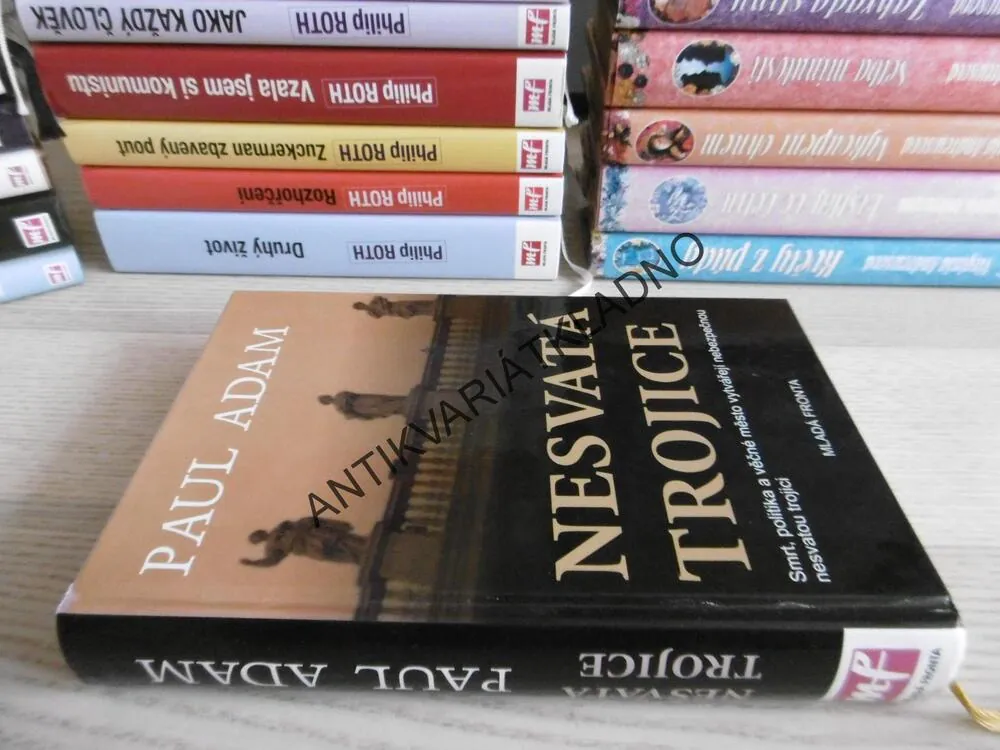 NESVATÁ TROJICE, PAUL ADAM, **an