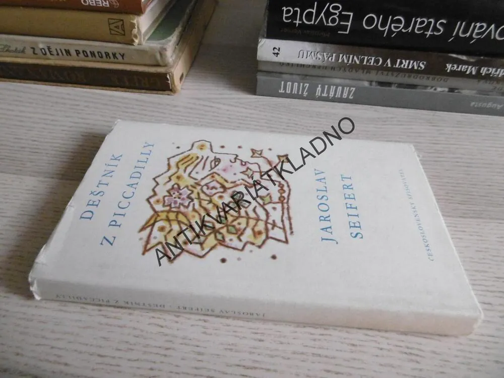 DEŠTNÍK Z PICCADILLY, JAROSLAV SEIFERT, **an