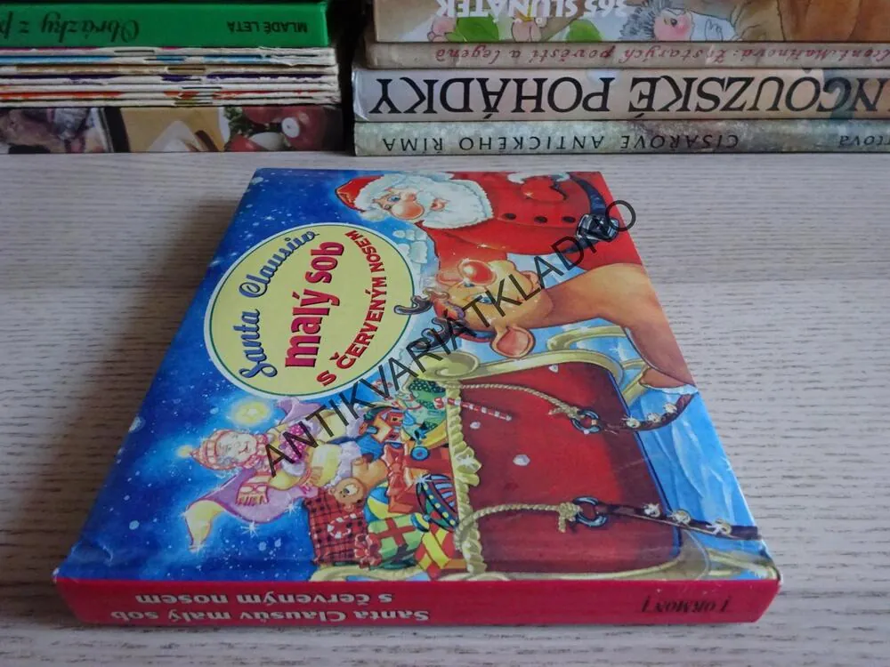 SANTA CLAUSŮV MALÝ SOB S ČERVENÝM NOSEM, **an