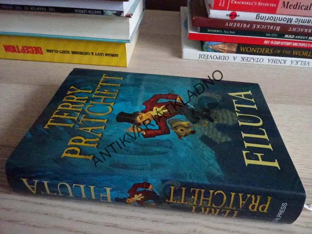 FILUTA, TERRY PRATCHETT, **an