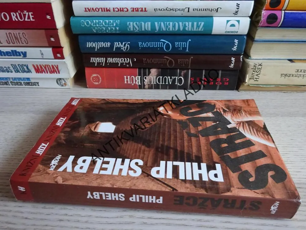 STRÁŽCE, PHILIP SHELBY, **an