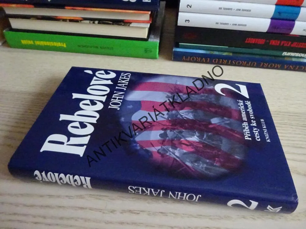 REBELOVÉ, JOHN JAKES, **an