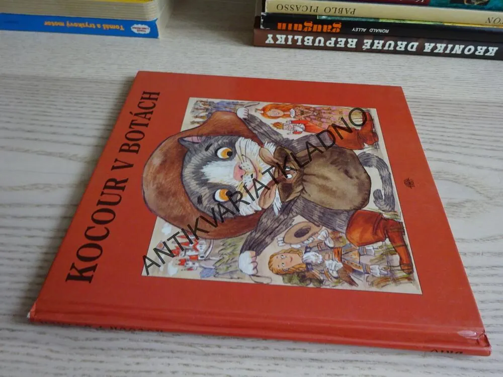 KOCOUR V BOTÁCH, **an