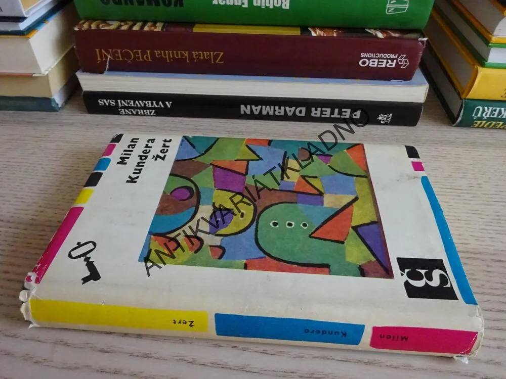 ŽERT, MILAN KUNDERA, **an