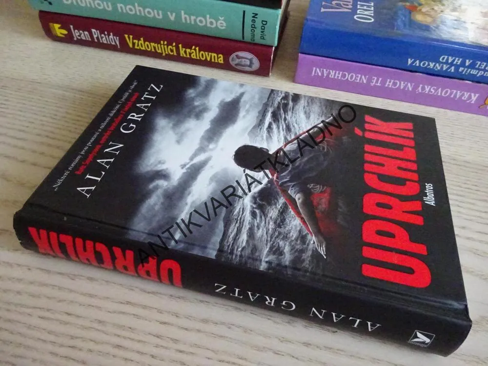 UPRCHLÍK, ALAN GRATZ, **an