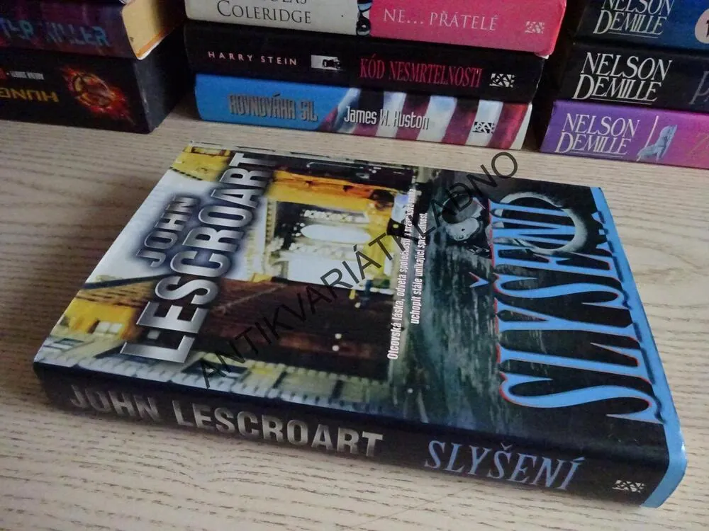 SLYŠENÍ, JOHN LESCROART, **an