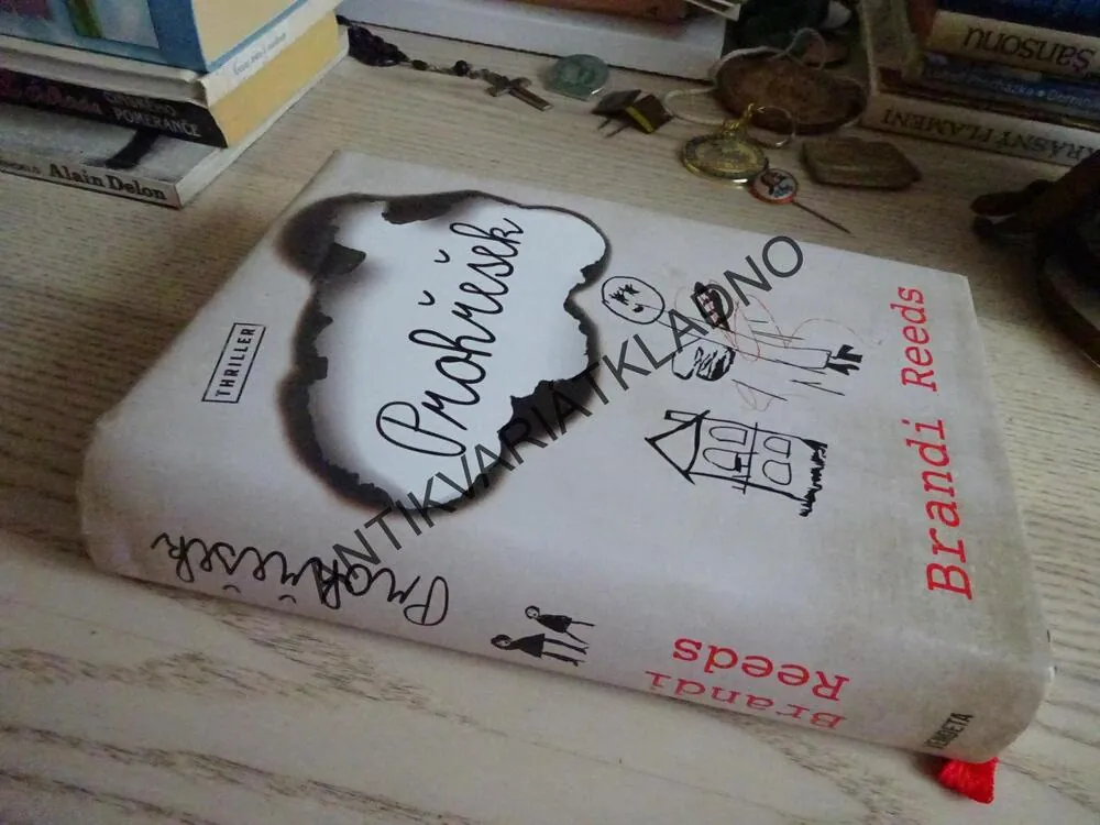 PROHŘEŠEK, BRANDI REEDS, **an