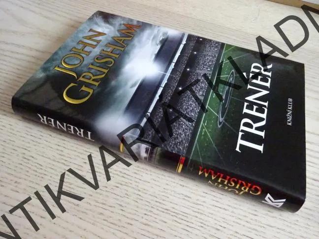 TRENÉR, JOHN GRISHAM, **an