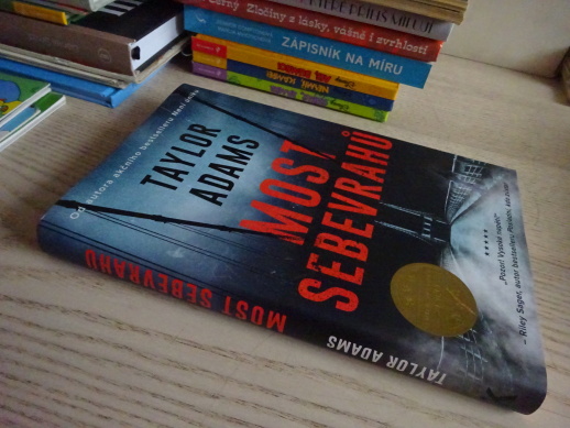 MOST SEBEVRAHŮ, TAYLOR ADAMS, **an