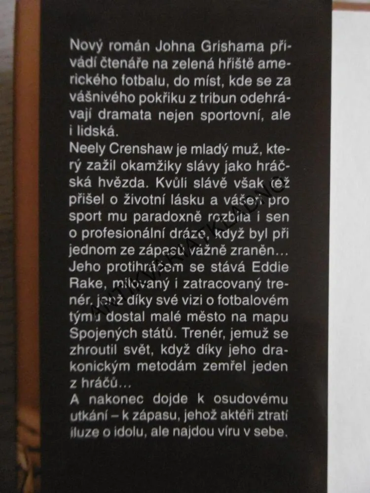 TRENÉR, JOHN GRISHAM, **an