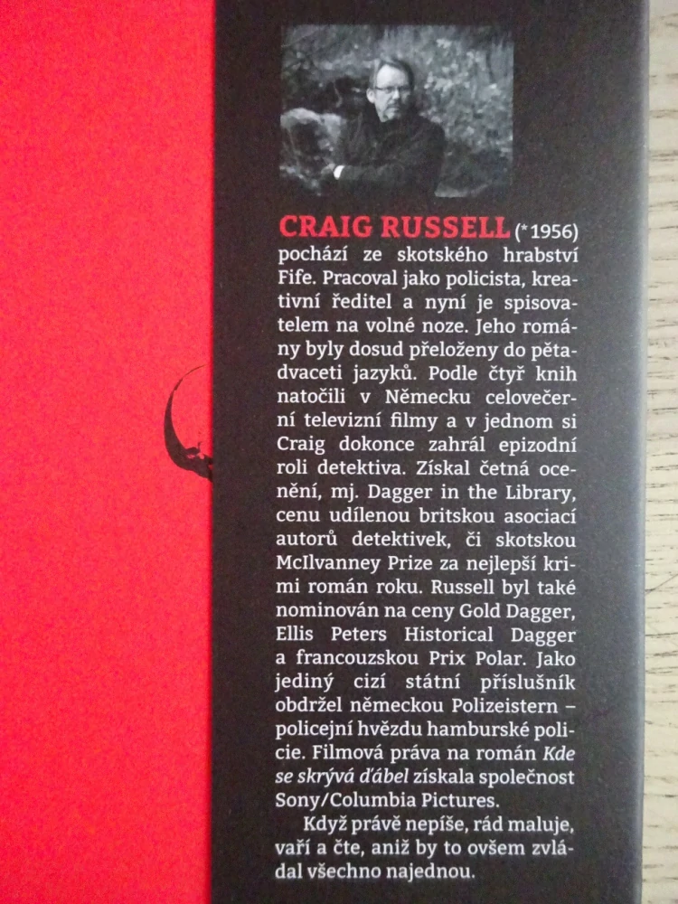 KDE SE SKRÝVÁ ĎÁBEL, CRAIG RUSSELL, **an