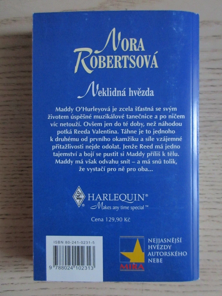 NEKLIDNÁ HVĚZDA, NORA ROBERTSOVÁ, **an