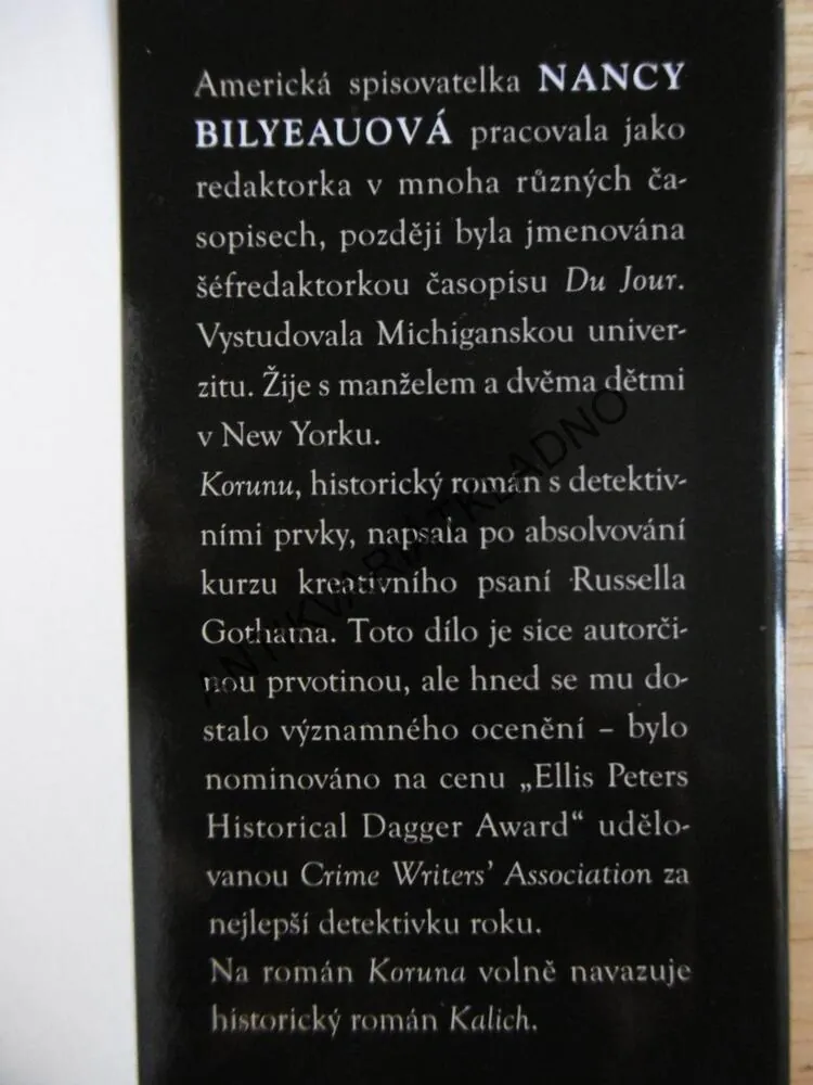 KORUNA, NANCY BILYEAUOVÁ, **an