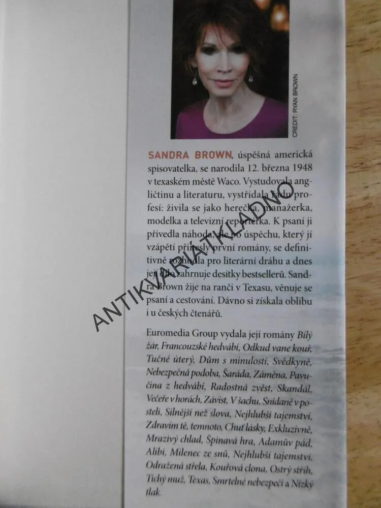 REPORTÉR, SANDRA BROWN, **an