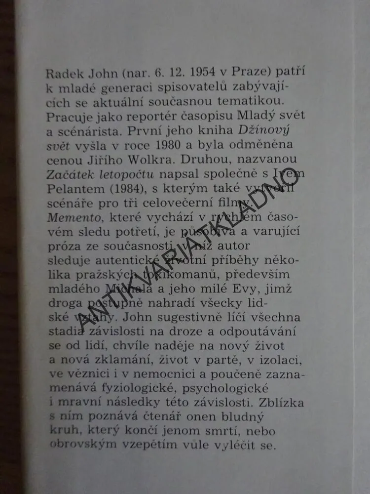 MEMENTO, RADEK JOHN, **an