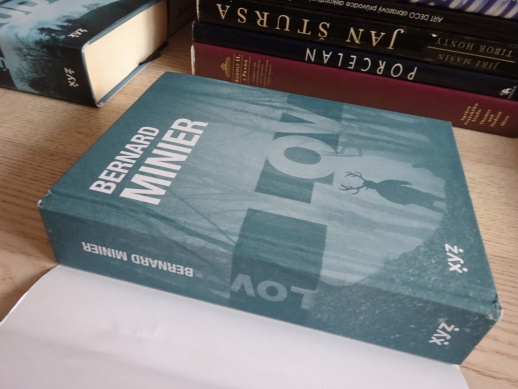 LOV, BERNARD MINIER, **an