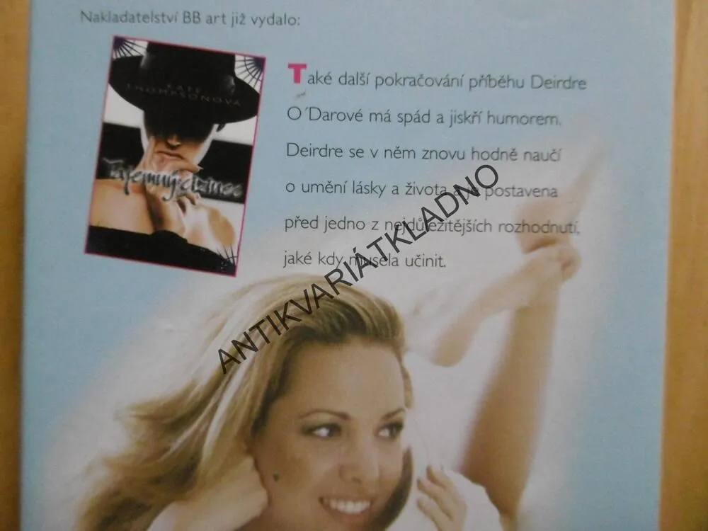 SLUNNÉ DNY, KATE THOMPSONOVÁ, **an