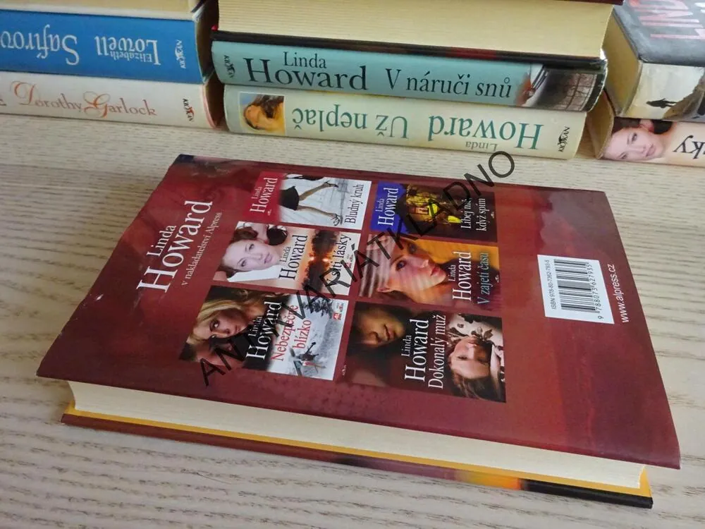 STÍNY ÚSVITU, LINDA HOWARD, **an
